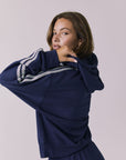 Chaser Abilene Sapphire Zip Up shown from a relaxed side angle highlighting the contrast stripe detail