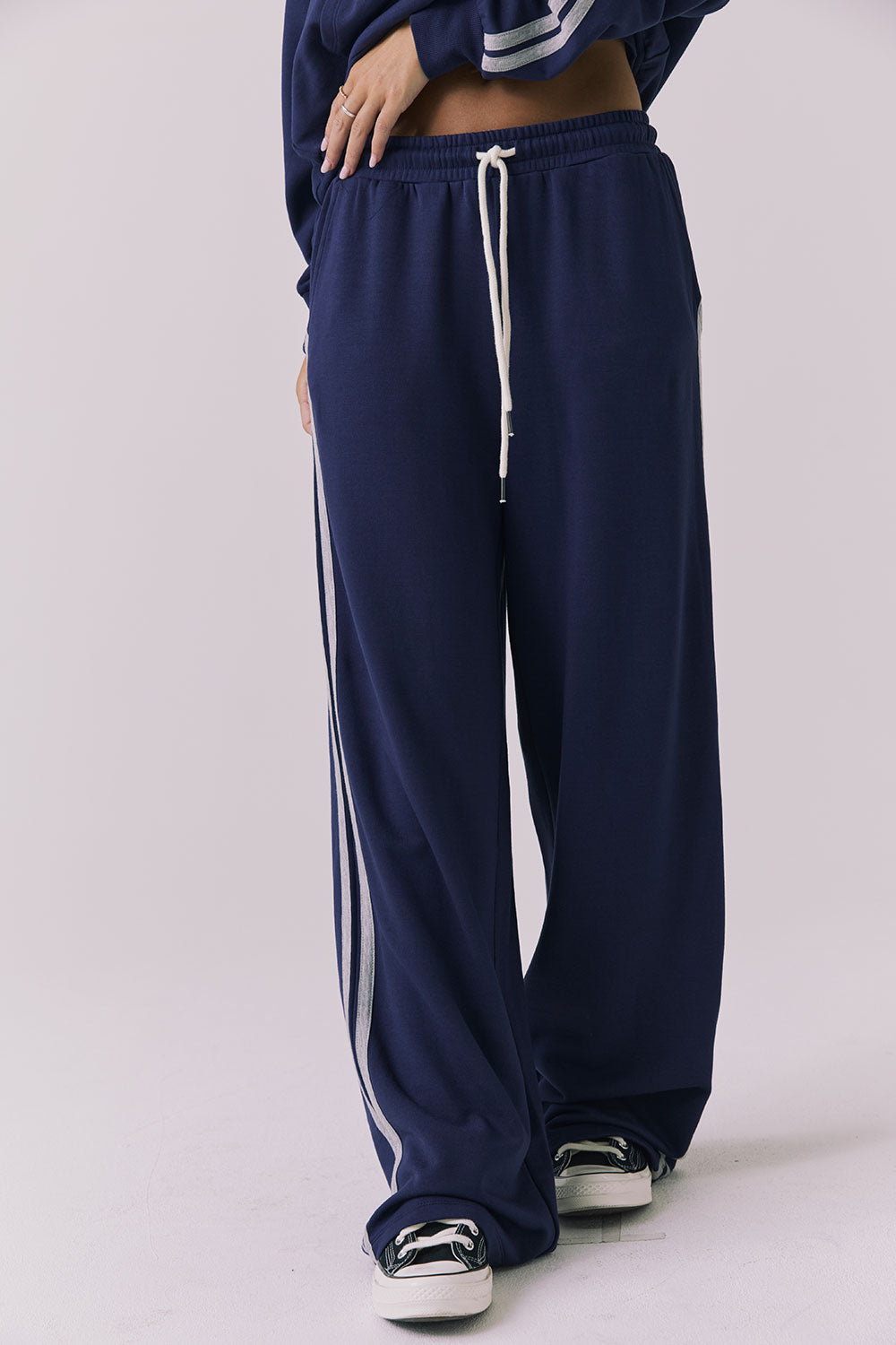 Saltwater Luxe Sandi Joggers in Sapphire and Heather Grey shown from the front with a relaxed wide leg silhouette elastic waistband and contrast side stripe detailing