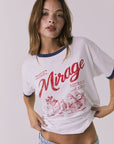 Front view of a woman wearing Chaser's white Desert Mirage Motor Club Tee with red text and graphics on a plain background