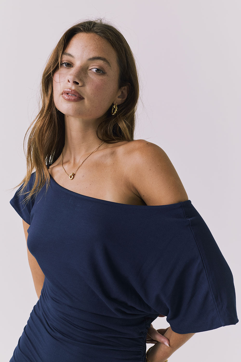 Chaser June Maxi Dress in Navy close up view emphasizing the off shoulder neckline soft stretch fabric and flattering ruching
