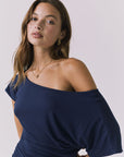 Chaser June Maxi Dress in Navy close up view emphasizing the off shoulder neckline soft stretch fabric and flattering ruching