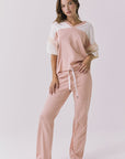 Chaser Palmer Tee in Starry White and Delicate Honey shown full body styled with matching joggers highlighting the coordinated set look and relaxed everyday fit