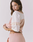 Chaser Palmer Tee in Starry White and Delicate Honey shown 3/4 side angle highlighting the easy drape through the body and contrast sleeve panels