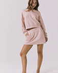 Full body view of the Chaser Campbell Honey Peach Pullover styled with the Soleil Mini Skort for a complete matching-set look