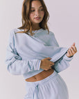 Chaser Campbell Bluebird Pullover side view highlighting the easy drape through the body and dropped shoulder silhouette
