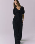 Chaser Abbie Black Blouse shown with matching Lee Trousers in a relaxed full body view as the model walks forward