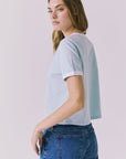 Chaser Jamesonn Tee in White and Mineral Butter shown side view with soft cropped length and subtle contrast trim