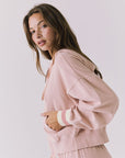 Chaser Abilene Honey Peach Zip Up hoodie captured from the side highlighting the slouchy hood and cozy brushed knit texture
