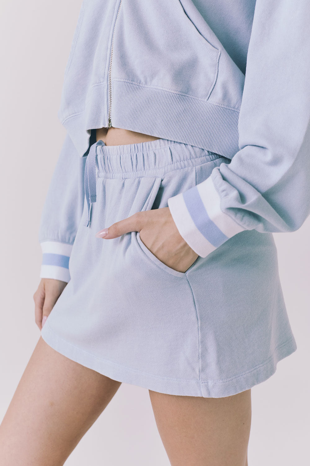Chaser Soleil Blue Bird Mini Skort in Blue Bird featuring a relaxed pull on fit and side pocket detail