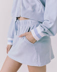 Chaser Soleil Blue Bird Mini Skort in Blue Bird featuring a relaxed pull on fit and side pocket detail