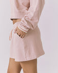 Chaser Soleil Honey Peach Mini Skort styled with the matching Campbell Pullover featuring a comfortable elastic waistband and easy pull-on fit