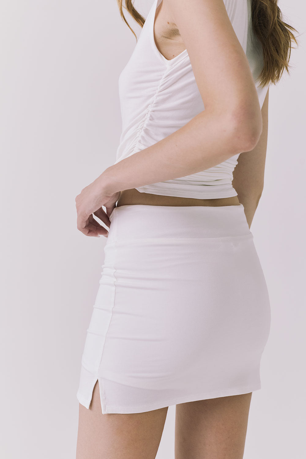 Chaser Rue White Skort in White highlighting the flattering mini length and contouring side seam