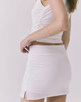 Chaser Rue White Skort in White highlighting the flattering mini length and contouring side seam
