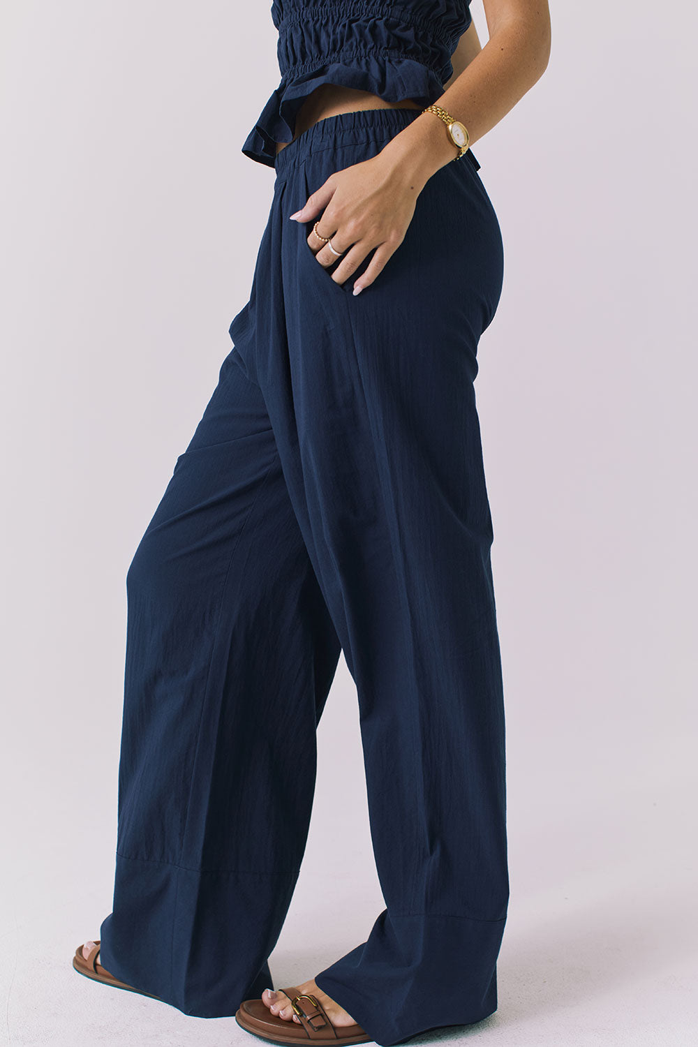 Chaser Dorit Trousers in Navy shown from the side highlighting the fluid drape and lightweight texture