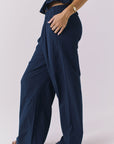 Chaser Dorit Trousers in Navy shown from the side highlighting the fluid drape and lightweight texture