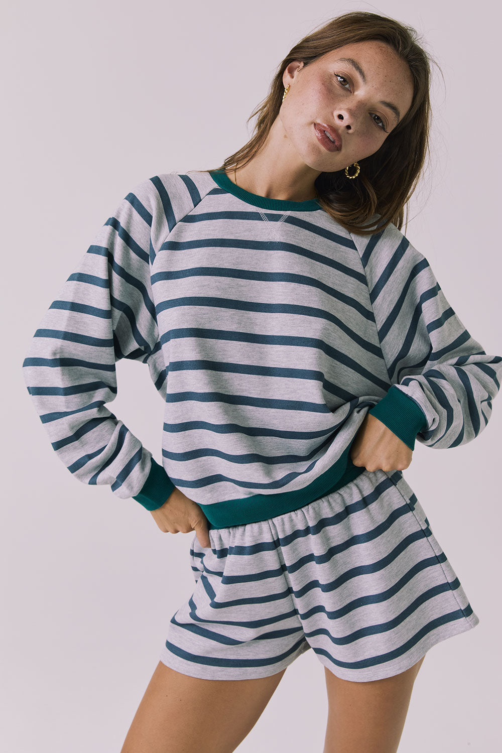 Front view of the Chaser Resort Stripe Long Sleeve Top in Heather Grey featuring horizontal stripe detailing and ribbed trim