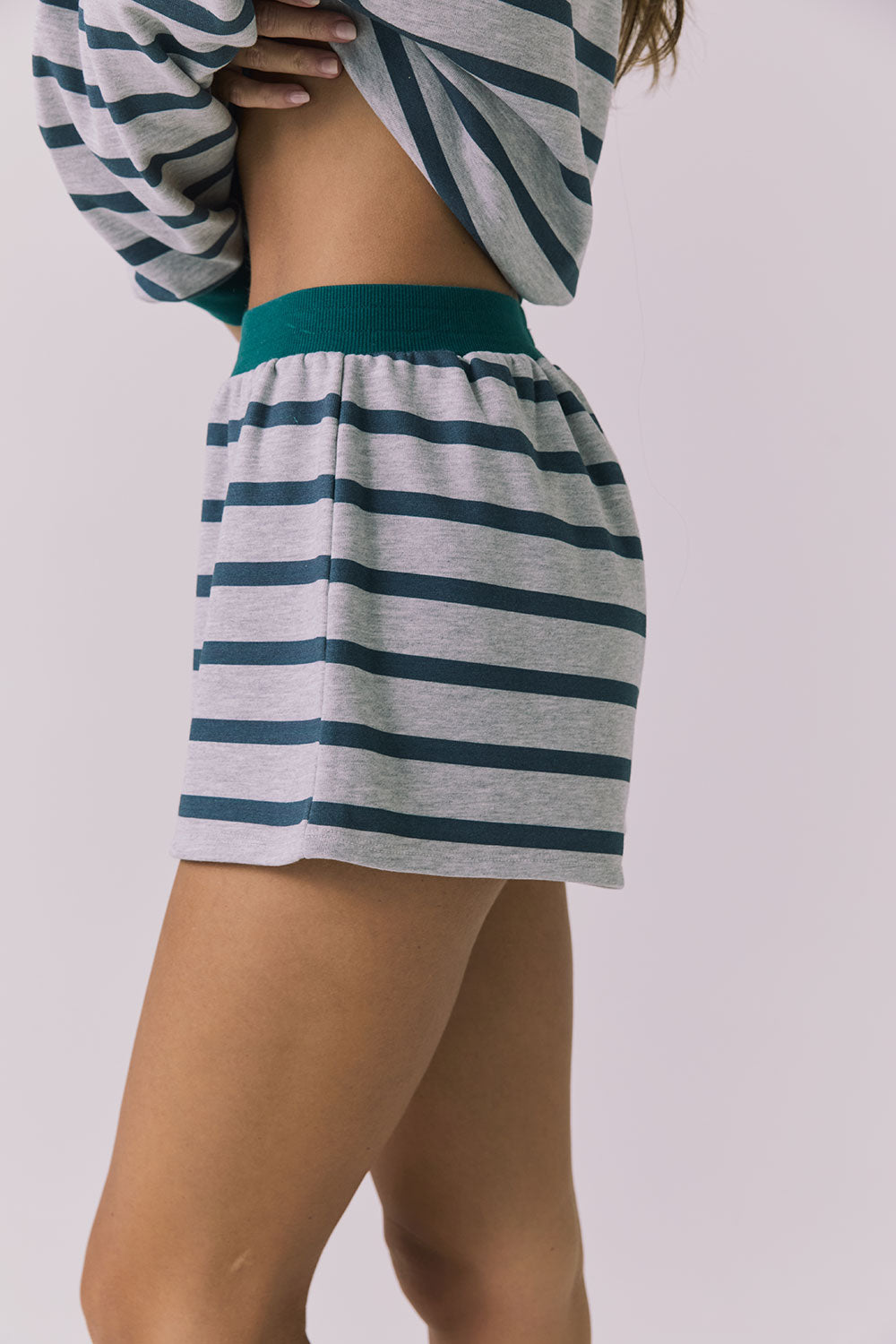 Side view of the Chaser Resort Stripe Shorts in Heather Grey showing the relaxed fit and stripe pattern