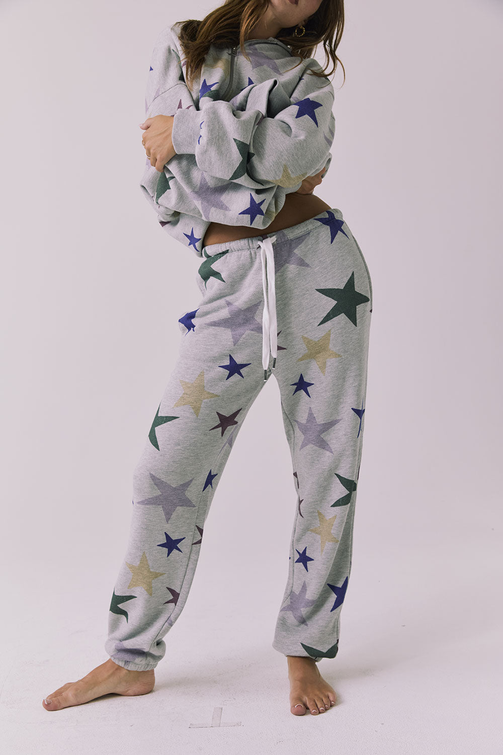 Chaser You’re A Star Pants in Heather Grey featuring an allover star print elastic waistband and relaxed jogger fit