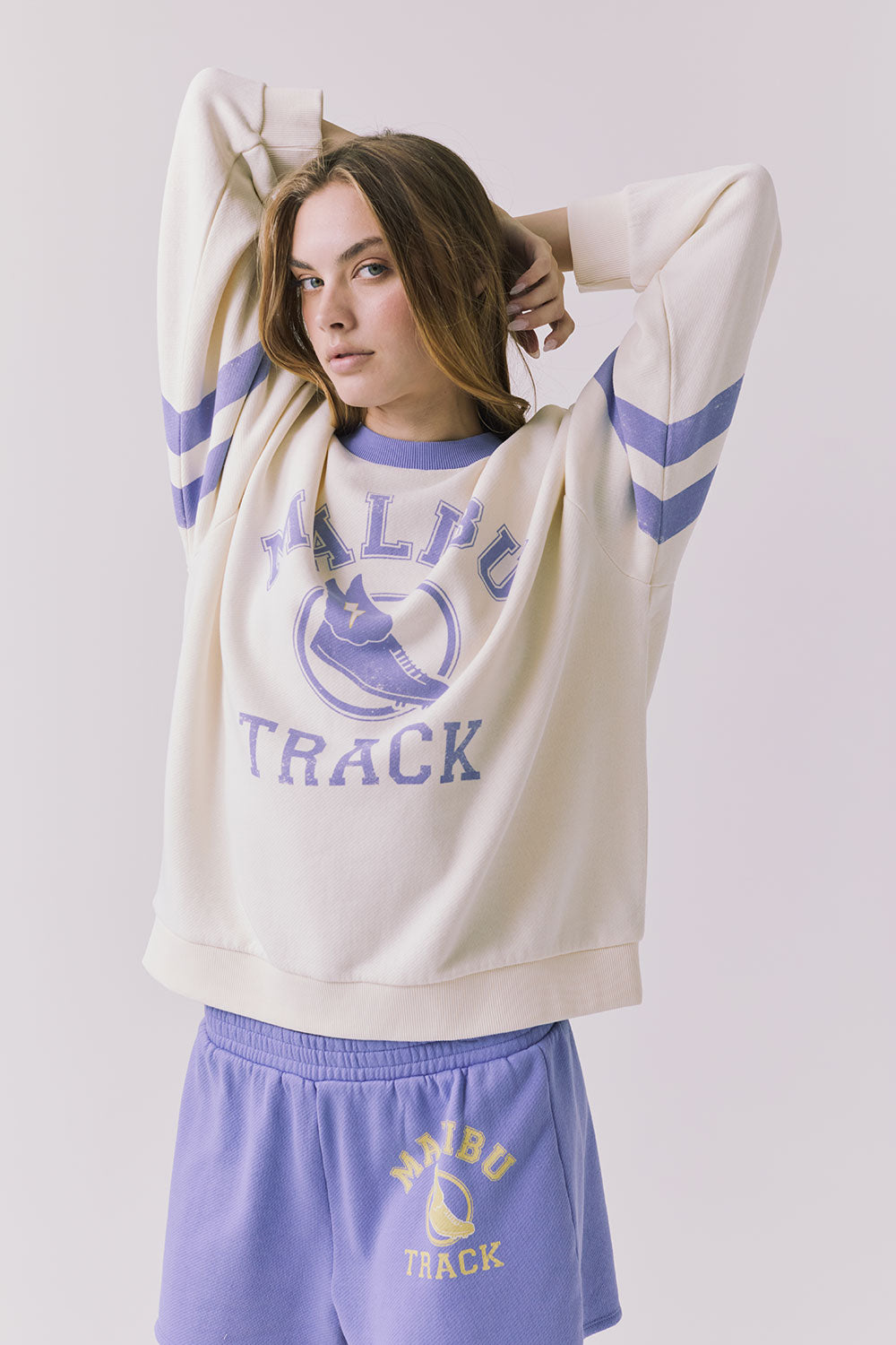 Chaser Malibu Track Long Sleeve in Starry White highlighting distressed Malibu Track print and contrast Soft Blue neckline detail