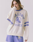 Chaser Malibu Track Long Sleeve Starry White with Soft Blue stripe detail styled with coordinating athletic shorts