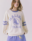 Chaser Malibu Track Long Sleeve in Starry White and Soft Blue with vintage Malibu Track graphic and varsity sleeve stripes in soft blue