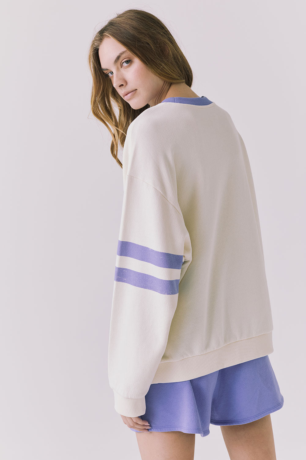 Chaser Malibu Track Long Sleeve in Starry White featuring soft blue sleeve stripes and relaxed drop shoulder fit