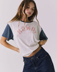 Chaser Howdy Tee in Starry White and Navy styled at an angle highlighting the relaxed drape soft crew neckline and vintage inspired graphic detail