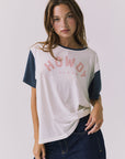 Chaser Howdy Tee in Starry White and Navy shown from the front featuring a soft pink collegiate Howdy graphic across the chest and contrast navy sleeves