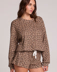 Front view of a woman wearing the Chaser Suzzans Leopard Sweatshirt on a neutral background with shorts
