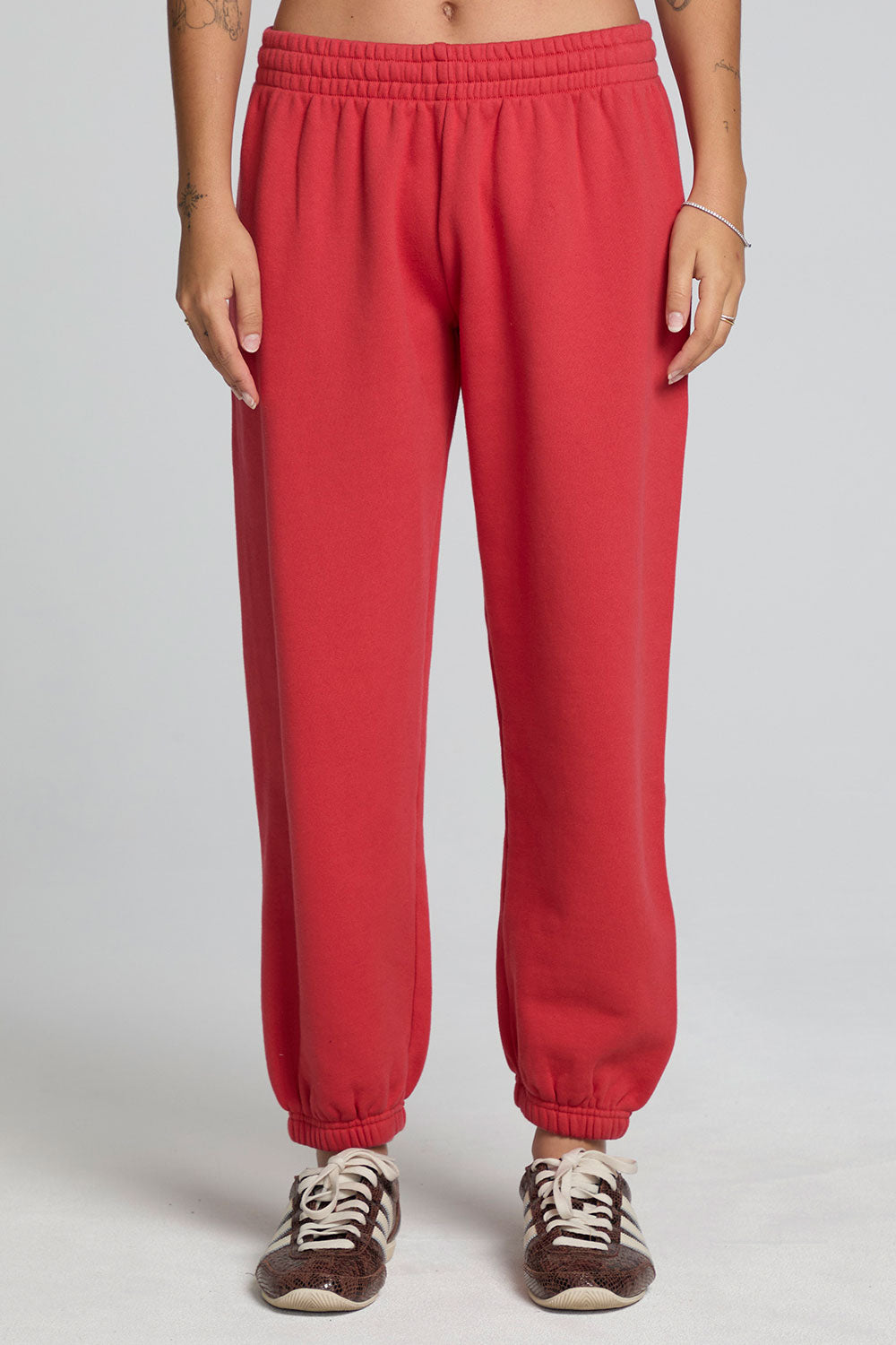 Front view of a woman wearing the Chaser Ada Dry Red Jogger on a neutral background with arms at sides