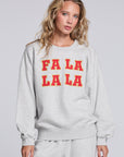 Model wearing Chaser's Fa La La La Pullover in Heather Grey with oversized red Fa La La La lettering, front view
