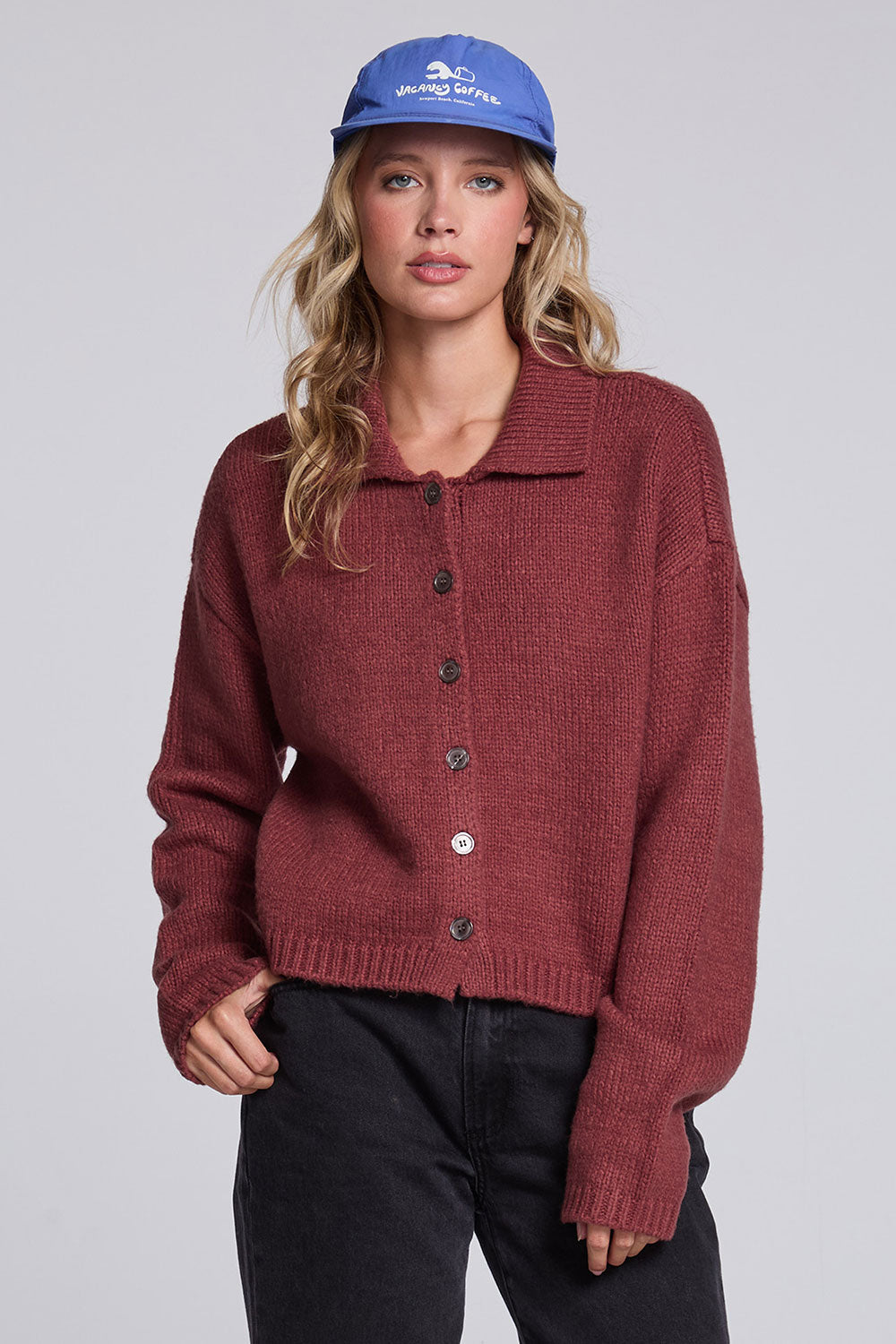 Model wearing Chaser's Hot Cocoa Fortune Cardigan in Hot Cocoa brown cropped button-front knit with pointed collar, front view