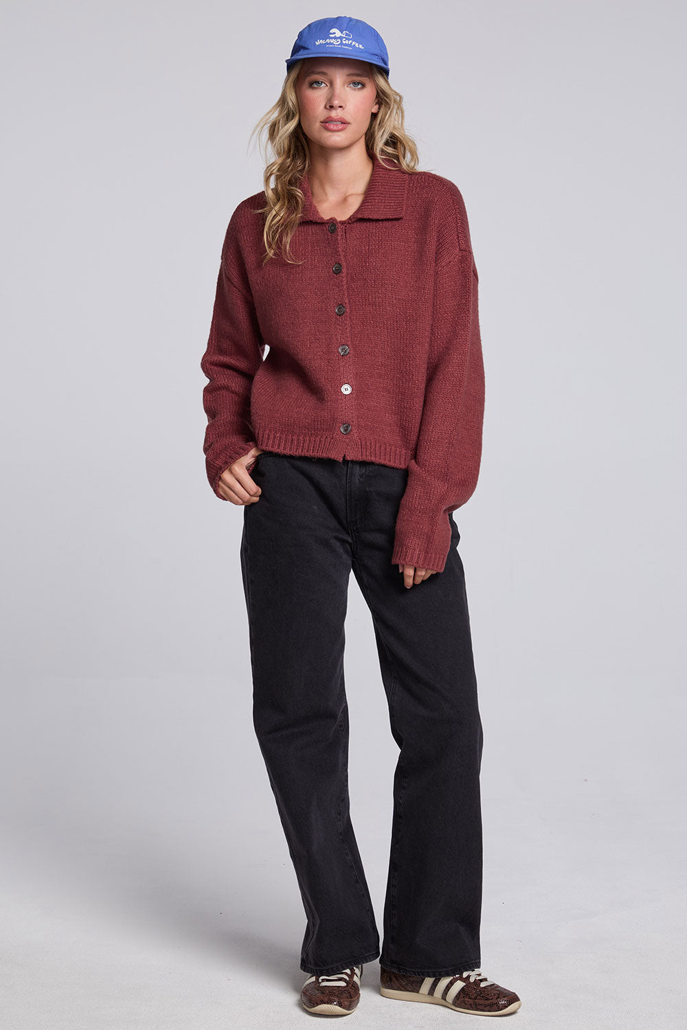Model wearing Chaser's Hot Cocoa Fortune Cardigan in Hot Cocoa brown cropped button-front knit with pointed collar, full-body view