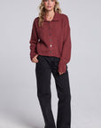 Model wearing Chaser's Hot Cocoa Fortune Cardigan in Hot Cocoa brown cropped button-front knit with pointed collar, full-body view