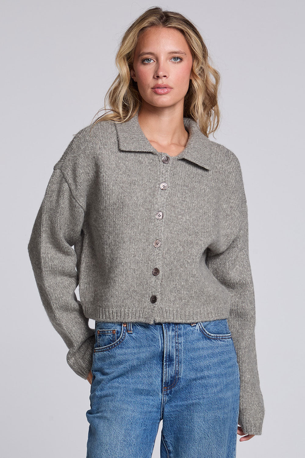 Model wearing Chaser's Winter Heather Grey Fortune Cardigan in Winter Heather Grey cropped button-front knit with pointed collar, front view