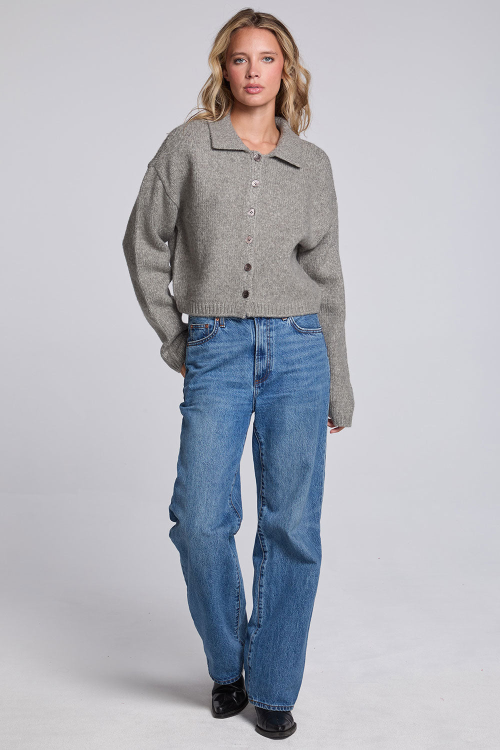Model wearing Chaser's Winter Heather Grey Fortune Cardigan in Winter Heather Grey cropped button-front knit with pointed collar, full-body view