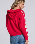 Model wearing Chaser's Cherry Bomb Emily Zip-Up in Cherry Bomb red hooded zip-up with contrast sleeve stripes, back view