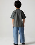 Full body back view of a boy wearing the Chaser  Car Show Tee on a neutral background