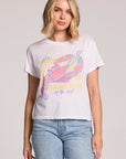 Front view of a woman wearing the Chaser  Catch Of The Day Tee and jeans on a neutral background