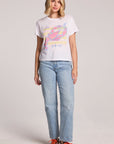 Front view of a woman wearing the Chaser  Catch Of The Day Tee and sneakers on a neutral background