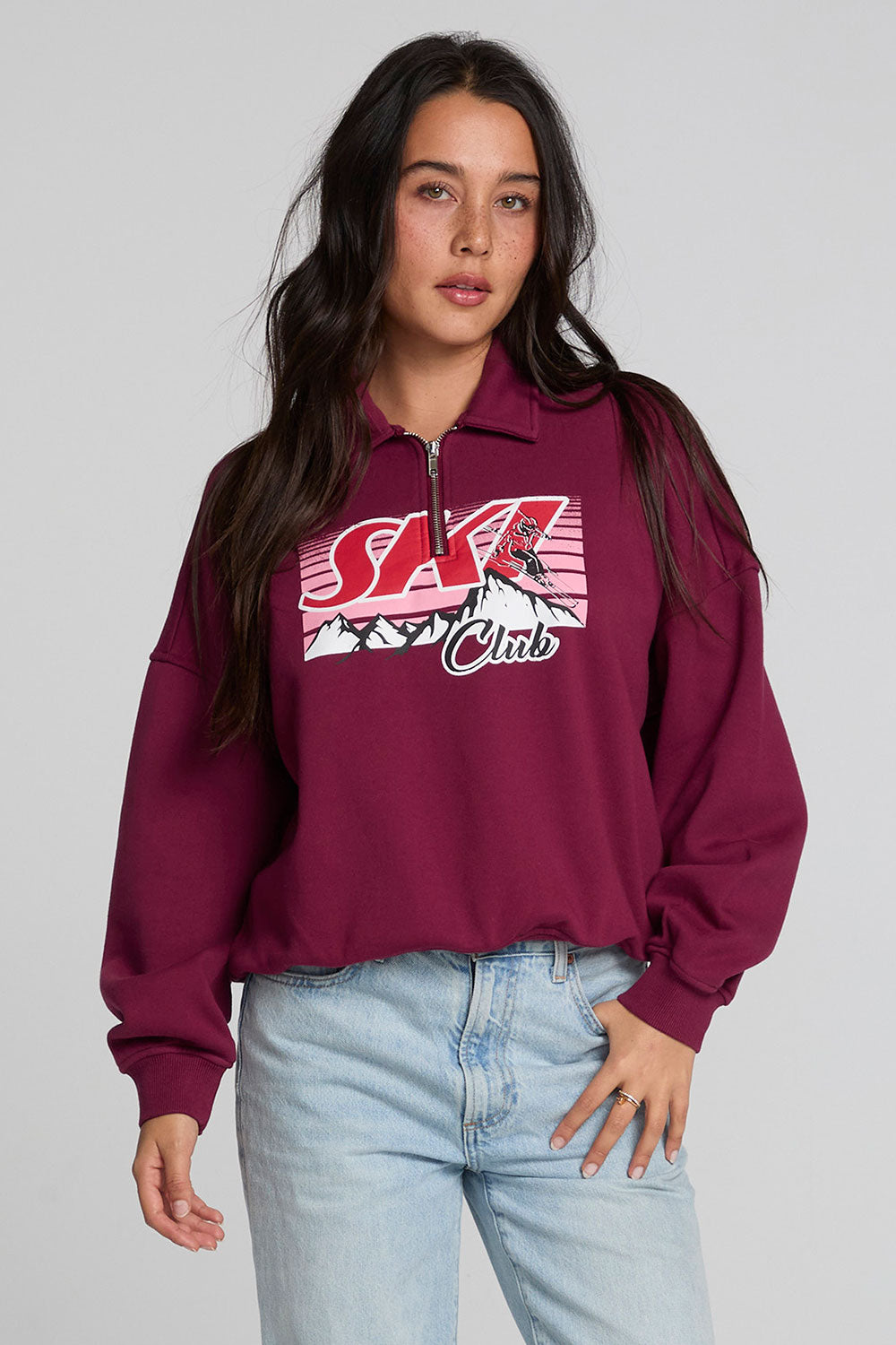 Front view of a woman wearing the Chaser  1986 Ski Club Long Sleeve on a neutral background