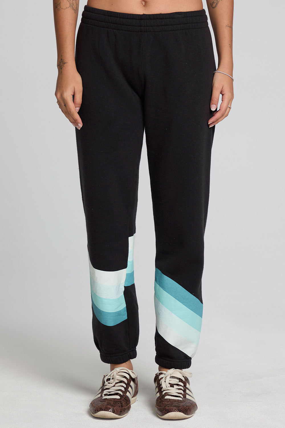 Front view of a woman wearing the Chaser Ada Black Jogger on a neutral background with arms at sides