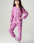 Full body front view of a girl wearing the Chaser Allover Sweethearts Girls Jogger on a neutral background with matching top