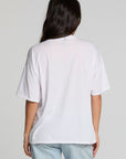 Back view of a woman wearing the Chaser Bagged Italy Tee on a neutral background with jeans