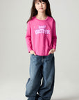 A full body front view of a girl wearing the Chaser Best Sister Girls Tee on a neutral background