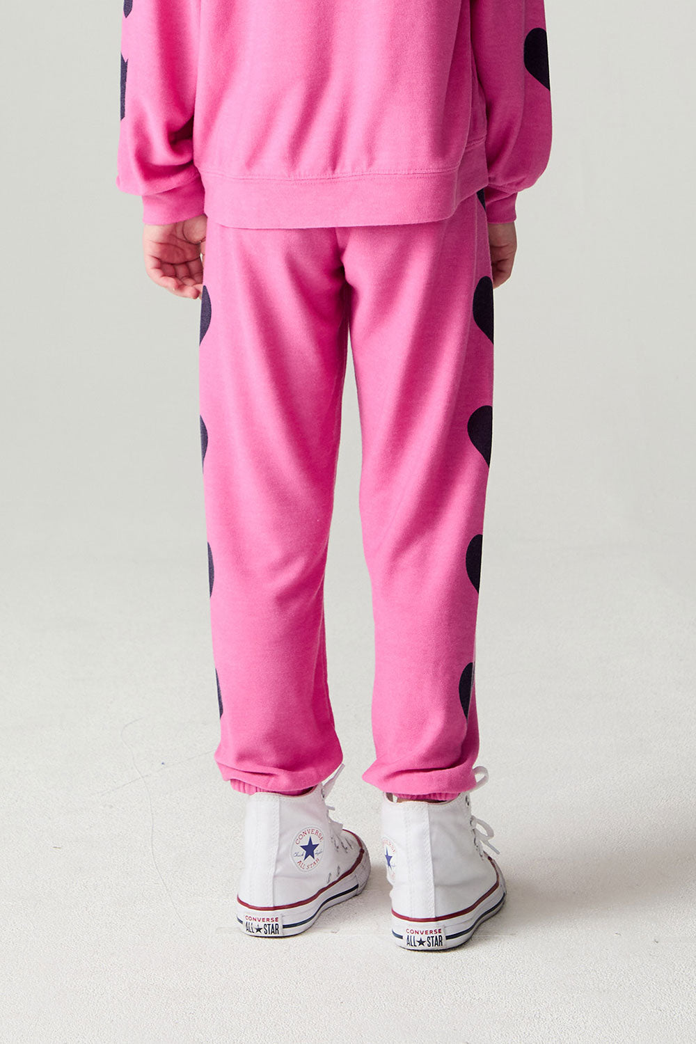 Back view of a girl wearing the Chaser  Big Love Girls Jogger on a neutral background