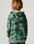 Back view of a boy wearing the Chaser Blocked Camo Boys Hoodie on a neutral background with arms at sides