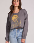 Front view of a woman wearing the Chaser Blondie Live Cropped Sweatshirt on a neutral background