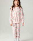 A full body front view of a girl wearing the Chaser Bolt Hearts Girls Jogger on a neutral background