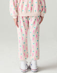 Back  view of a girl wearing the Chaser Bolt Hearts Girls Jogger on a neutral background with top